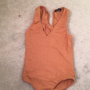 Rust orange body suit